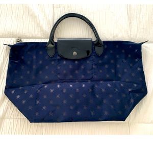 Longchamp limited edition Le Pliage Star Print Hand Held bag. Like new!